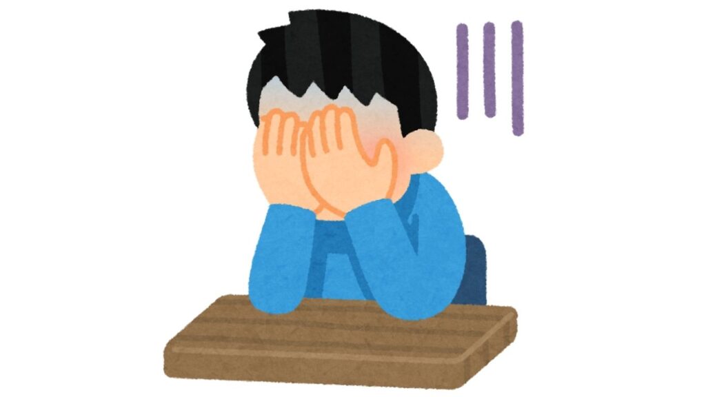 パソコンの前で頭を抱える男性のイラスト。